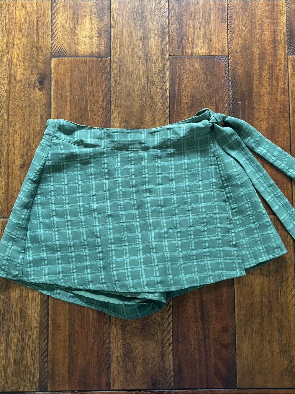 Francesca’s - green, grid-patterned asymmetric wrap skort